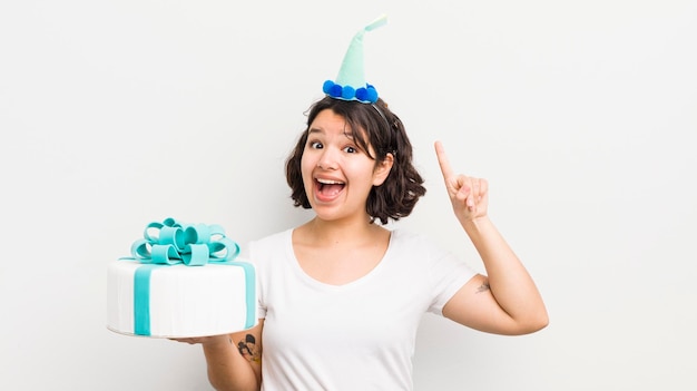 Pretty hispanic girl feeling like a happy and excited genius after realizing an idea birthday concept