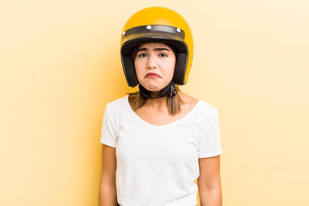 Pretty hispanic girl feeling sad and whiney with an unhappy look and crying motorbike concept