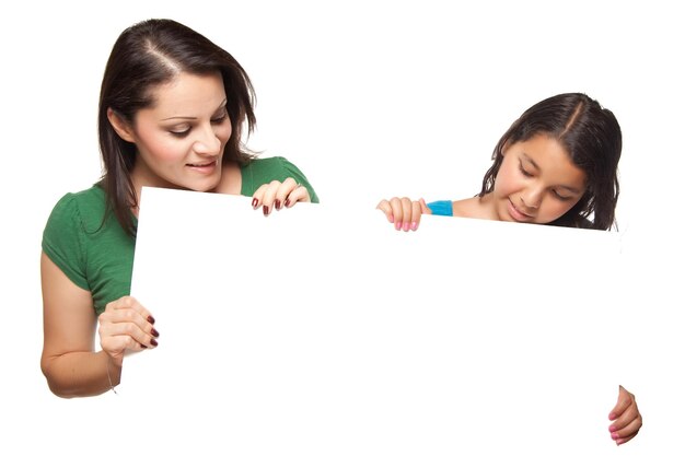 Pretty Hispanic Girl and Mother Holding Blank Board