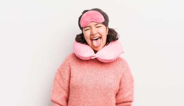 Pretty hispanic girl with cheerful and rebellious attitude joking and sticking tongue out flight passenger concept