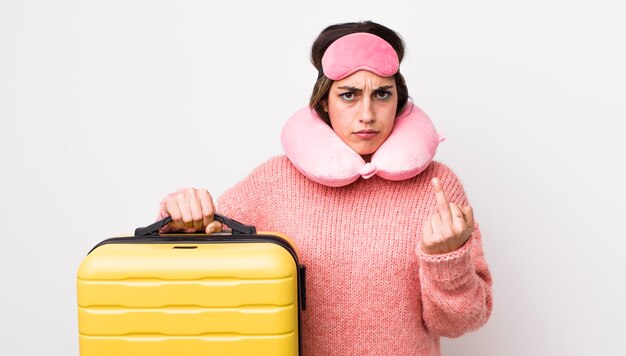 Pretty hispanic woman feeling angry annoyed rebellious and aggressive flight passenger concept