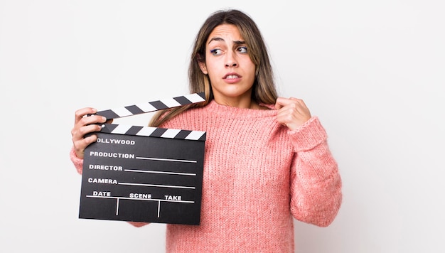 Pretty hispanic woman feeling stressed anxious tired and frustrated cinema clapper concept