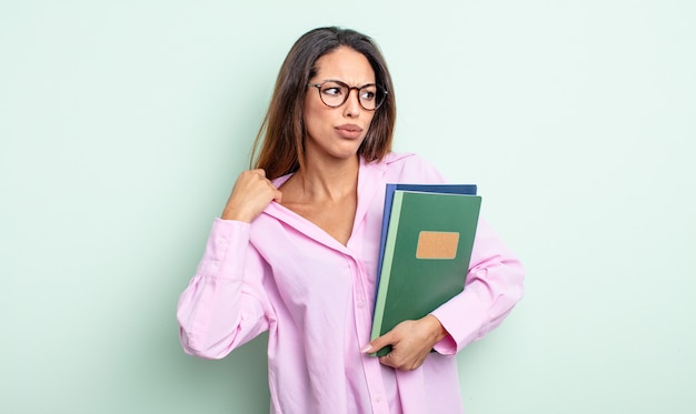 Pretty hispanic woman feeling stressed, anxious, tired and frustrated. notebooks concept