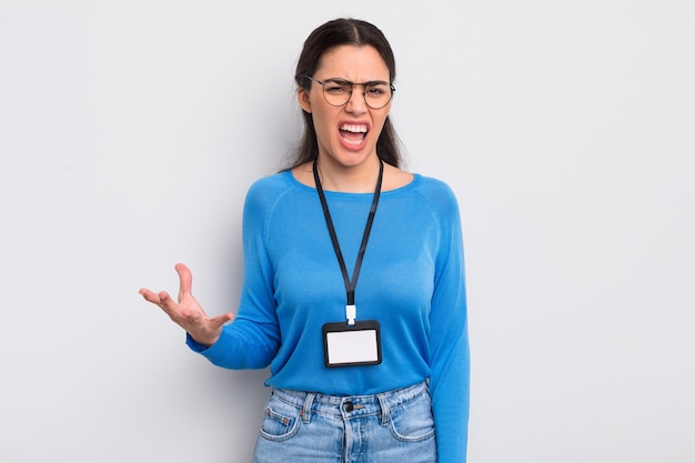 Pretty hispanic woman looking angry, annoyed and frustrated. accreditation concept