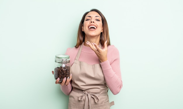 Pretty hispanic woman looking desperate, frustrated and stressed. coffee beans concept