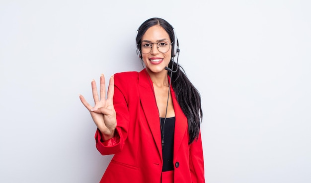 Pretty hispanic woman smiling and looking friendly, showing number four. telemarketing concept