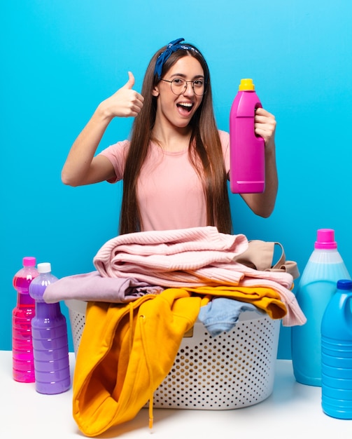 Pretty housekeeper woman washing clothes