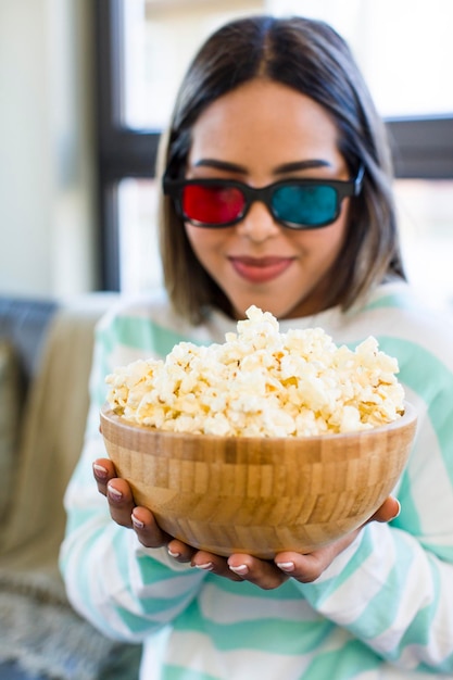 Pretty latin woman film and popcorn