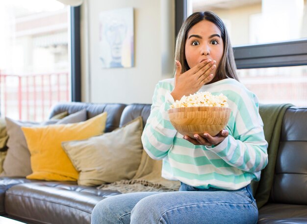 Pretty latin woman film and popcorn