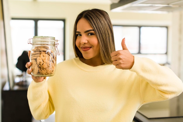 Pretty latin woman with home made cookies bottles