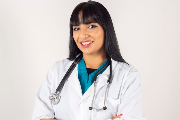 Pretty latina doctor, on white background