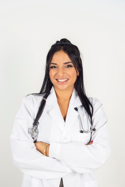 Pretty latina doctor, on white background