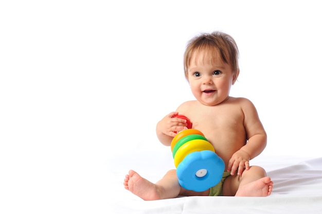 Pretty little baby playing with toys