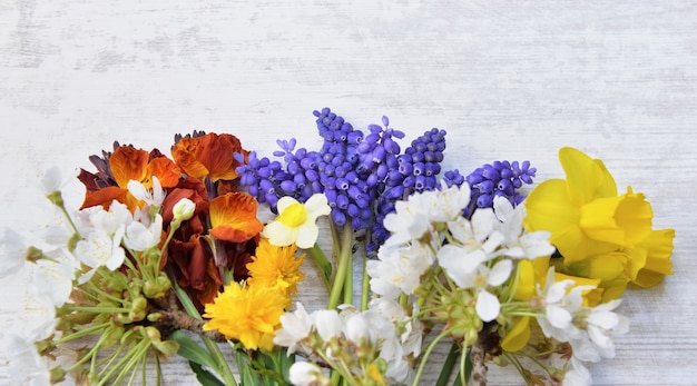 Pretty little bouquet of fresh flowers picked in the garden on white table