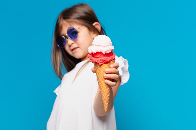 Pretty little girl happy expression and holding an ice cream