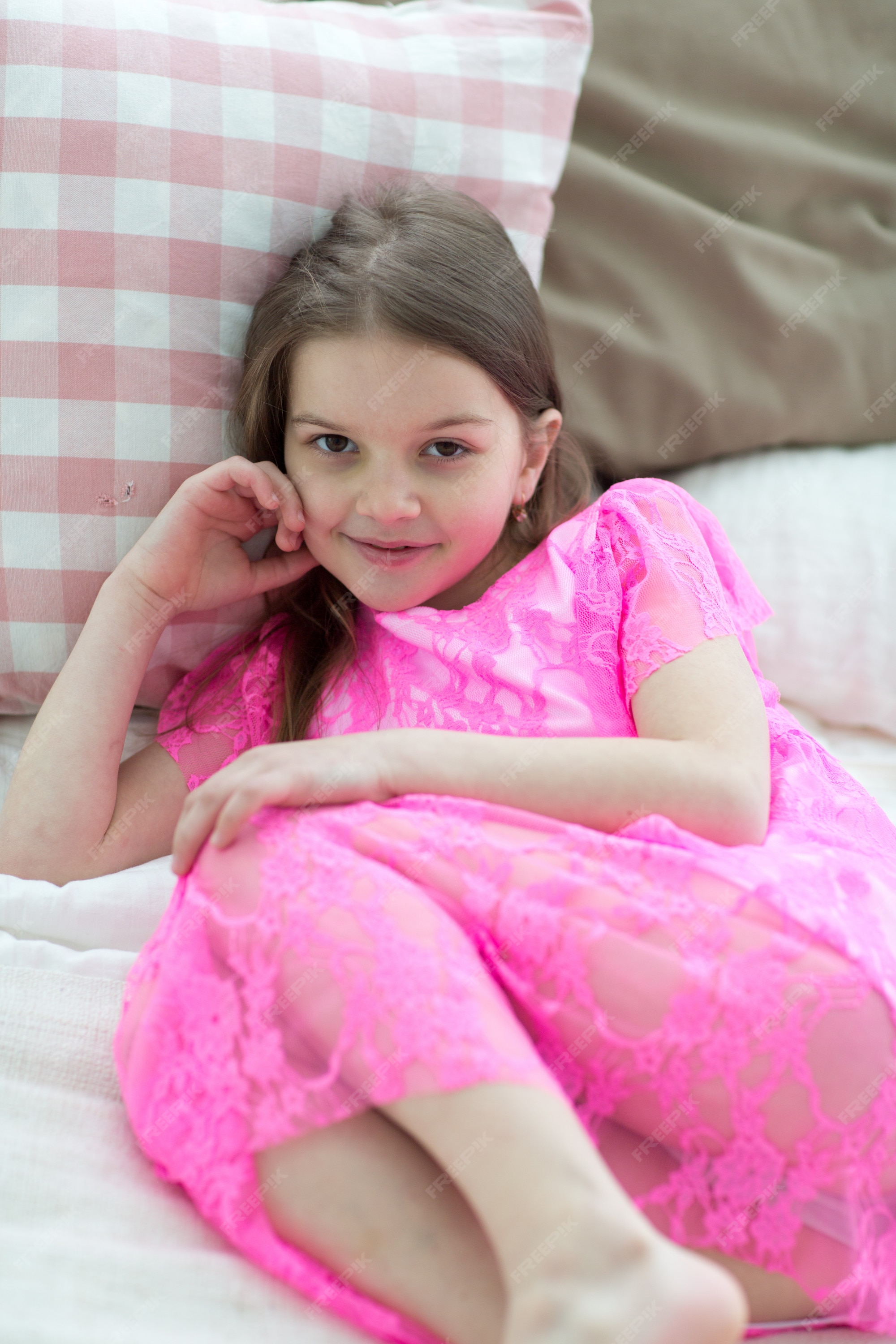 Premium Photo Pretty little girl in pink princess dress in bed with