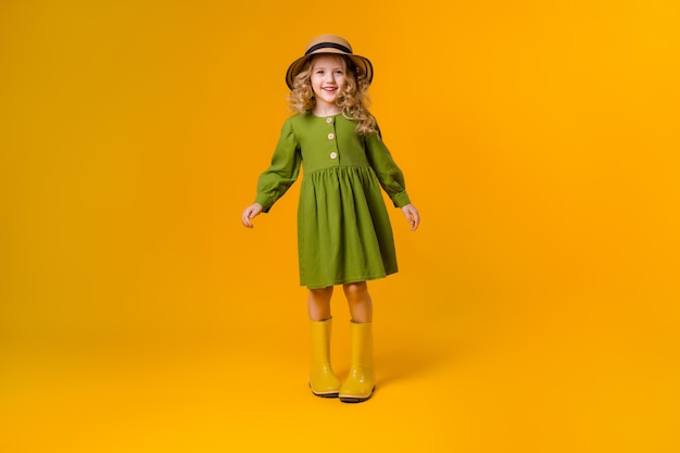 Pretty little girl posing in a studio