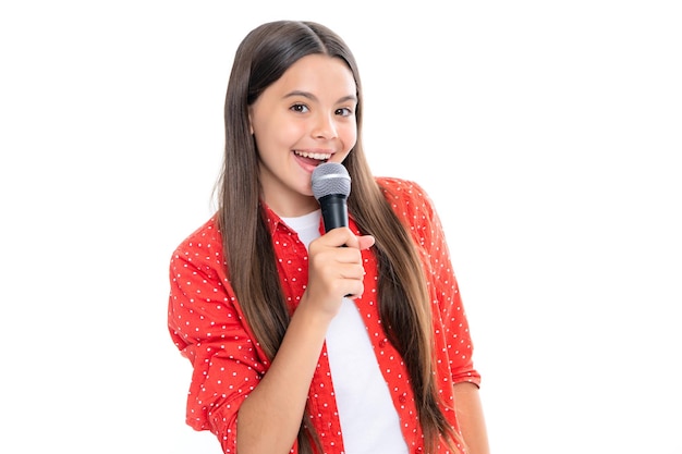 Pretty little girl singing with the microphone Portrait of emotional amazed excited teen girl Portrait of happy smiling teenage child girl