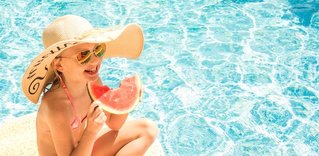 Pretty little girl in swimming pool