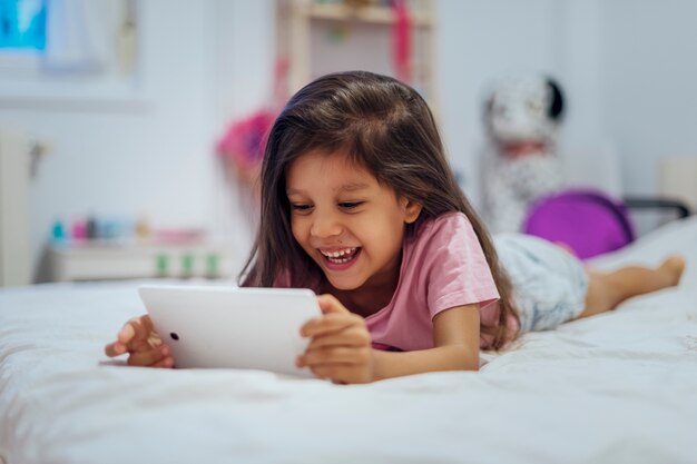 Pretty little girl using a smartphone