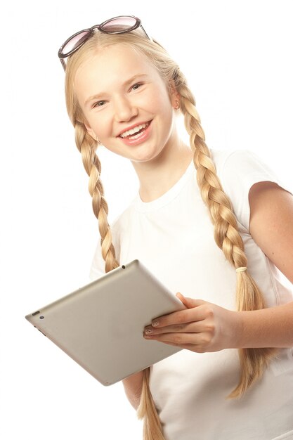 Pretty little girl with a Tablet PC 