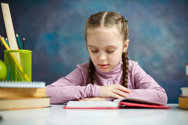 Pretty Little Schoolgirl Reading a Book 