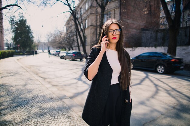 Pretty model speaking on smartphone