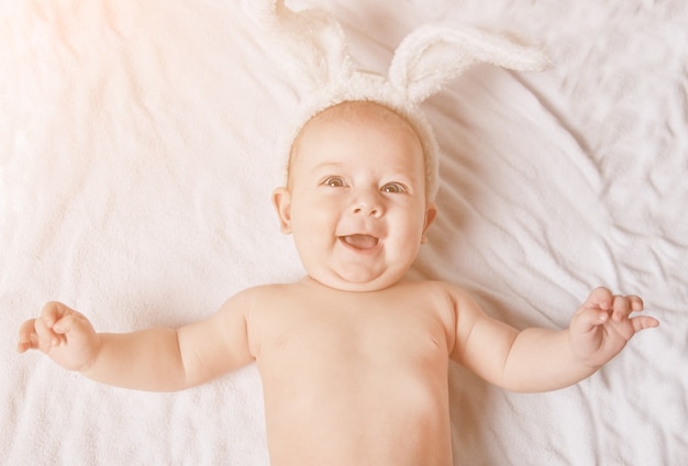 Pretty newborn boy in a rabbit costume