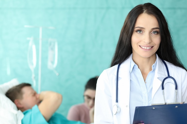 Pretty physician in medical gown