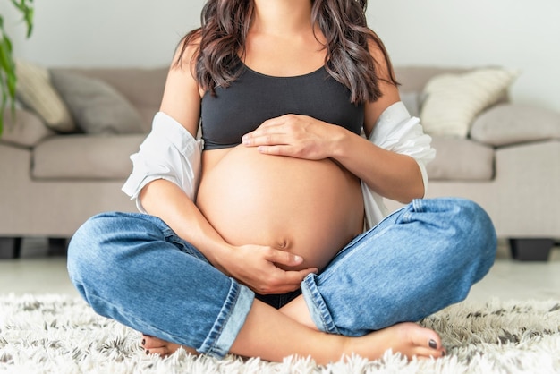 Pretty pregnant woman at home