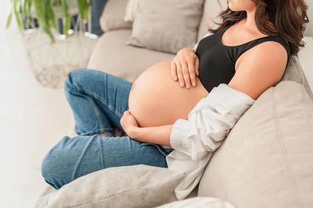 Pretty pregnant woman at home