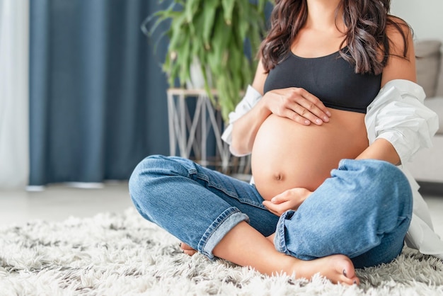 Pretty pregnant woman at home