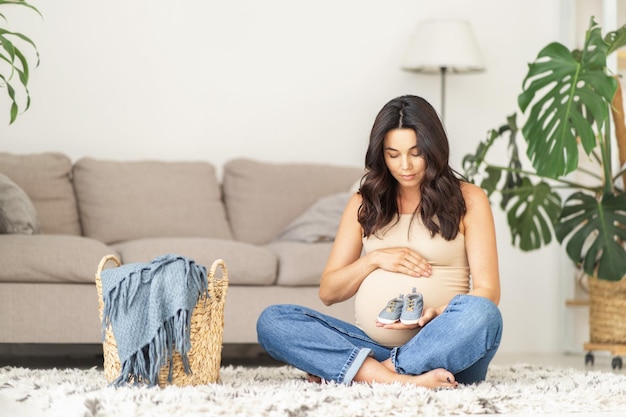 Pretty pregnant woman at home