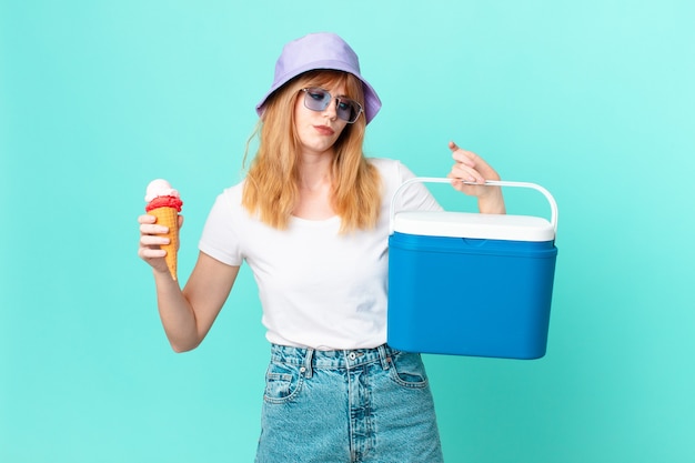 Pretty red head woman and an ice cream