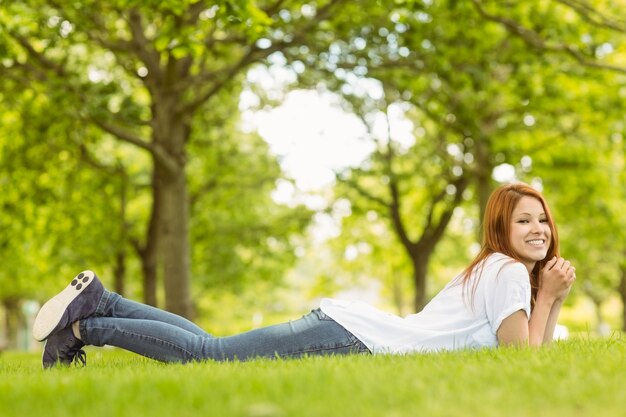 Pretty redhead cheerful and lying