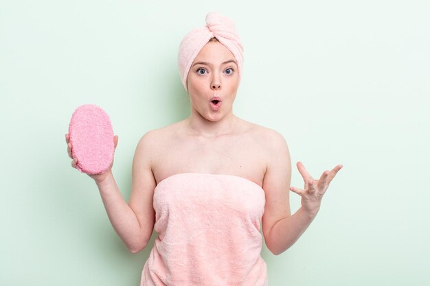 pretty redhead woman having a shower concept