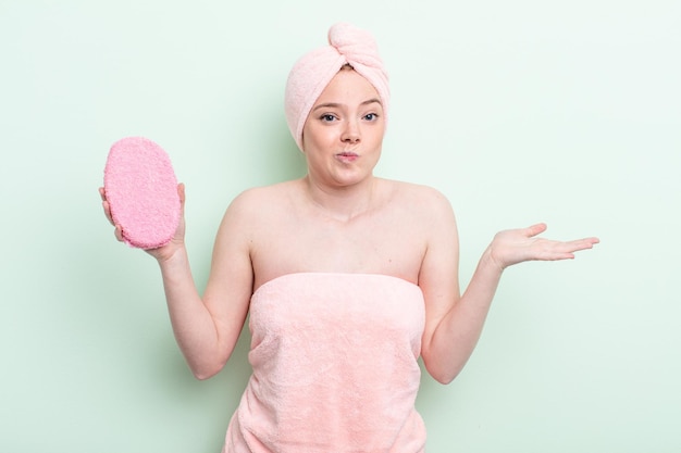 Pretty redhead woman having a shower concept