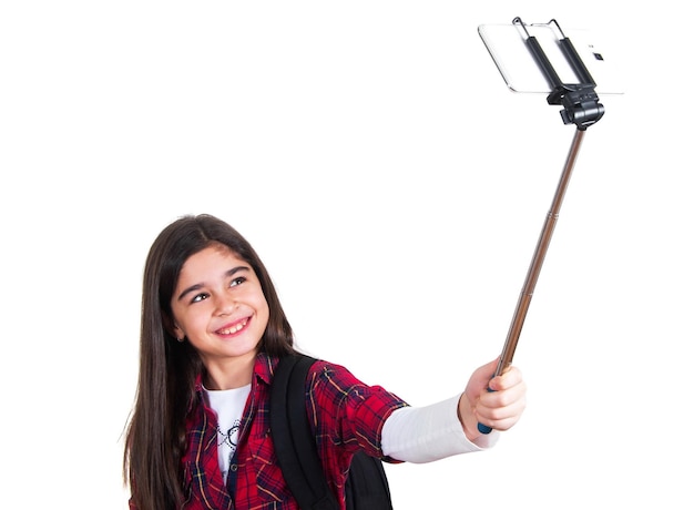 Photo pretty school girl doing selfie