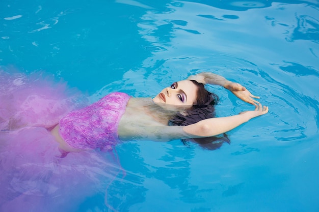 Pretty sexy woman in swimming pool