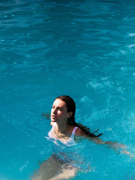 Pretty sexy woman in swimming pool