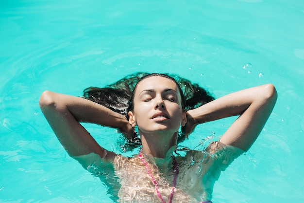 Pretty sexy woman in swimming pool