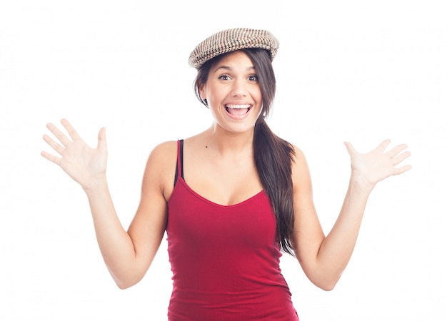 Pretty smiling and cheerful brunette woman with french cap and red tank top