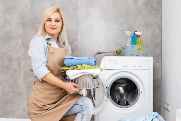 pretty smiling girl in the laundry room