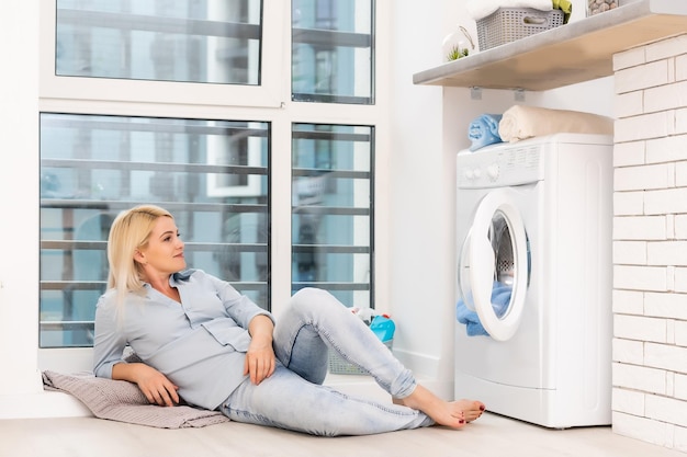 pretty smiling girl in the laundry room