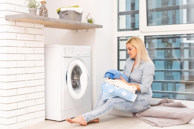 pretty smiling girl in the laundry room