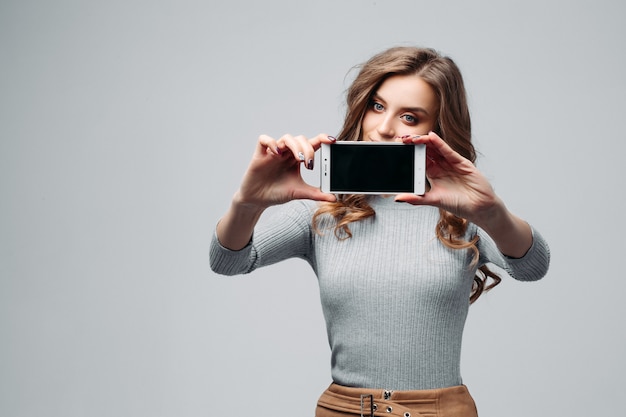 Pretty smiling woman doing photos