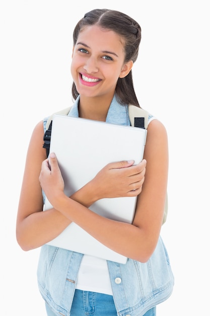 Pretty student holding her laptop