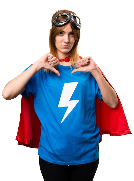 Pretty superhero girl making bad signal