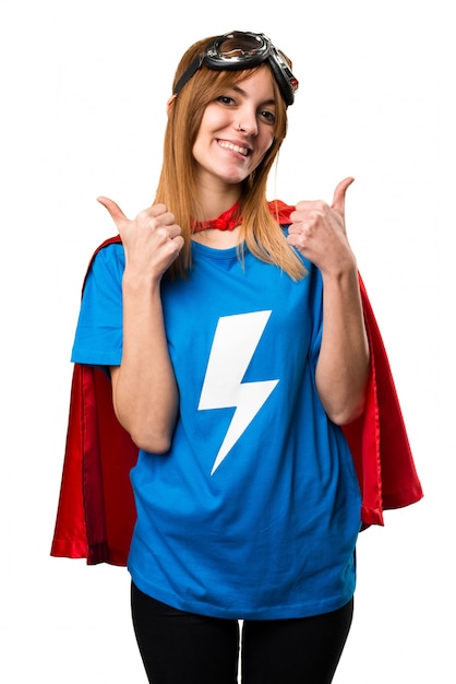 Pretty superhero girl with thumb up