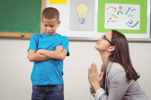 Pretty teacher begging pupil for something